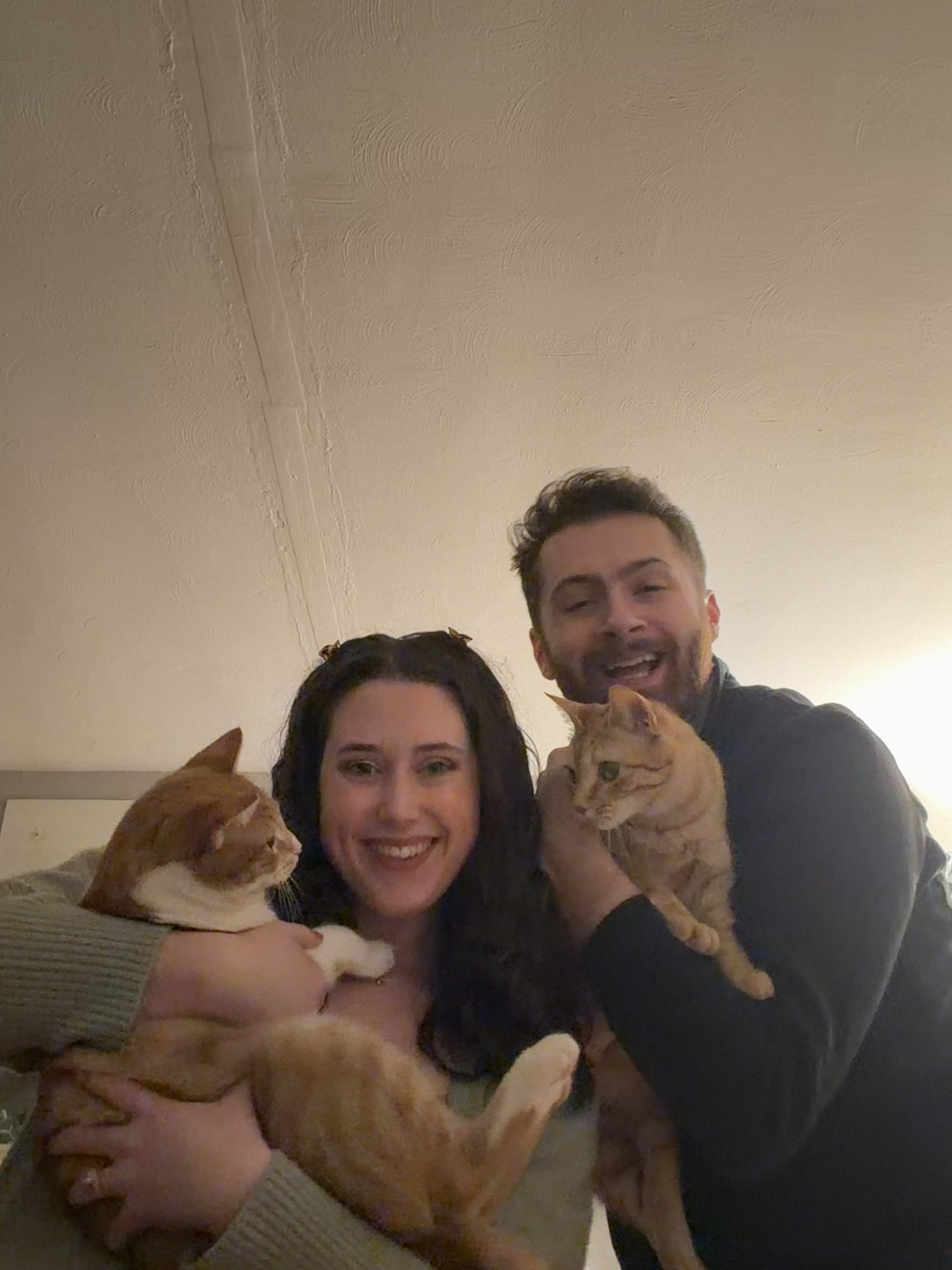 Jess and her partner holding Panini and Rotini