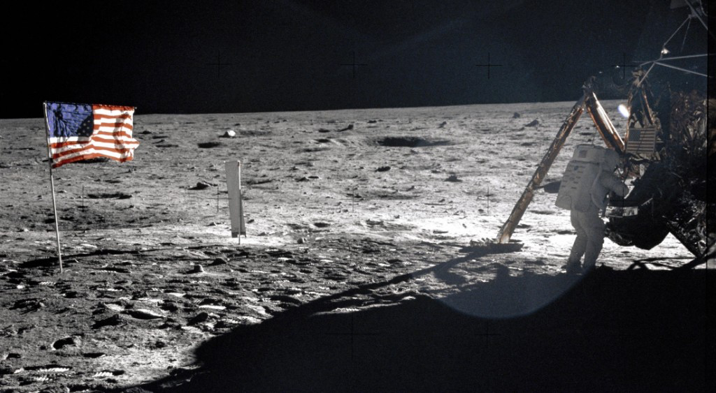 Astronaut on the lunar surface beside the lander, representing the on-site perspective during a spacewalk.